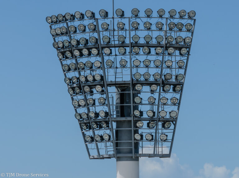 Aerial view of a lighting tower at a sportsground, showcasing drone services in asset inspections